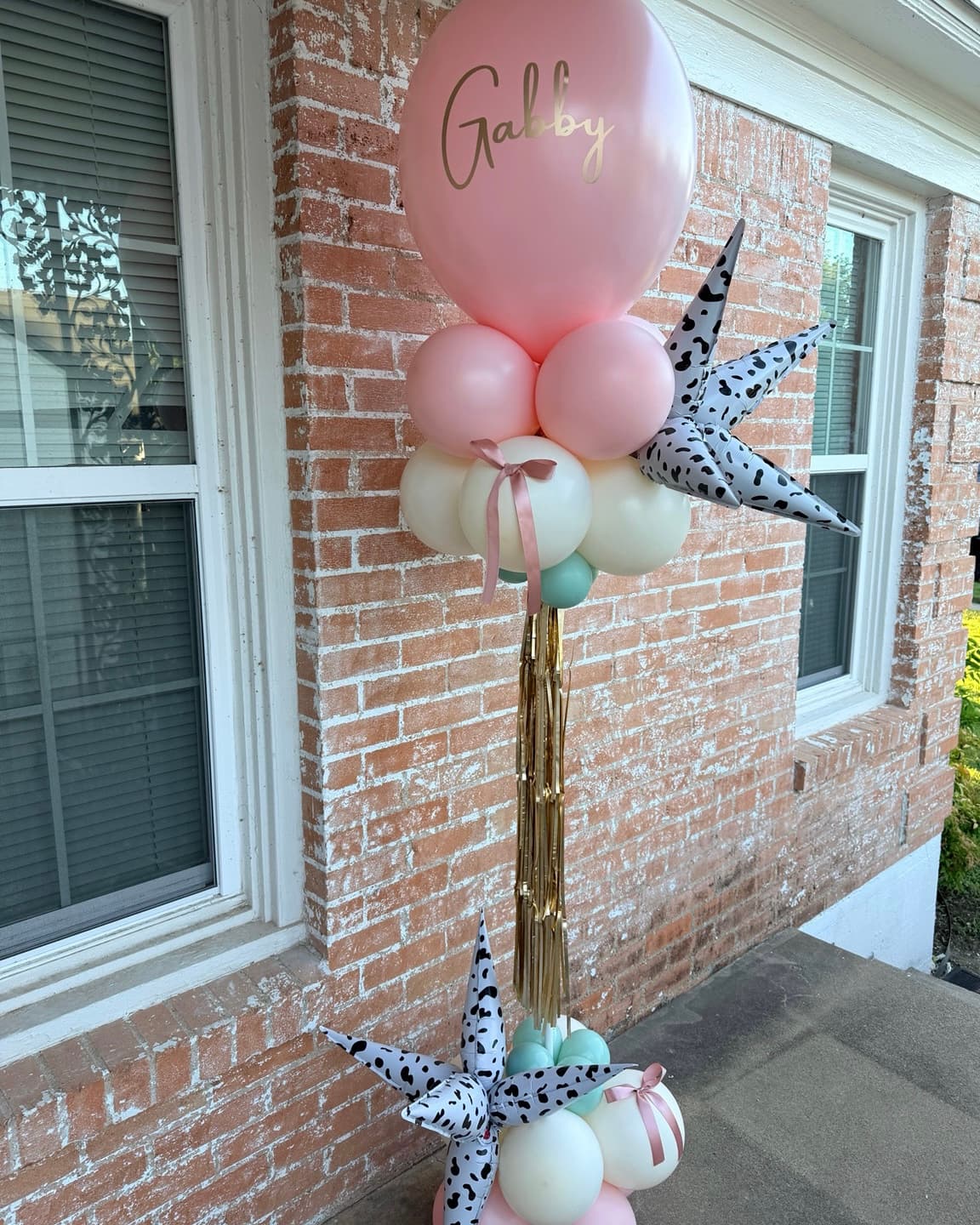 Balloon Tower: a seven-foot three-color balloon column topped with a foil starburst